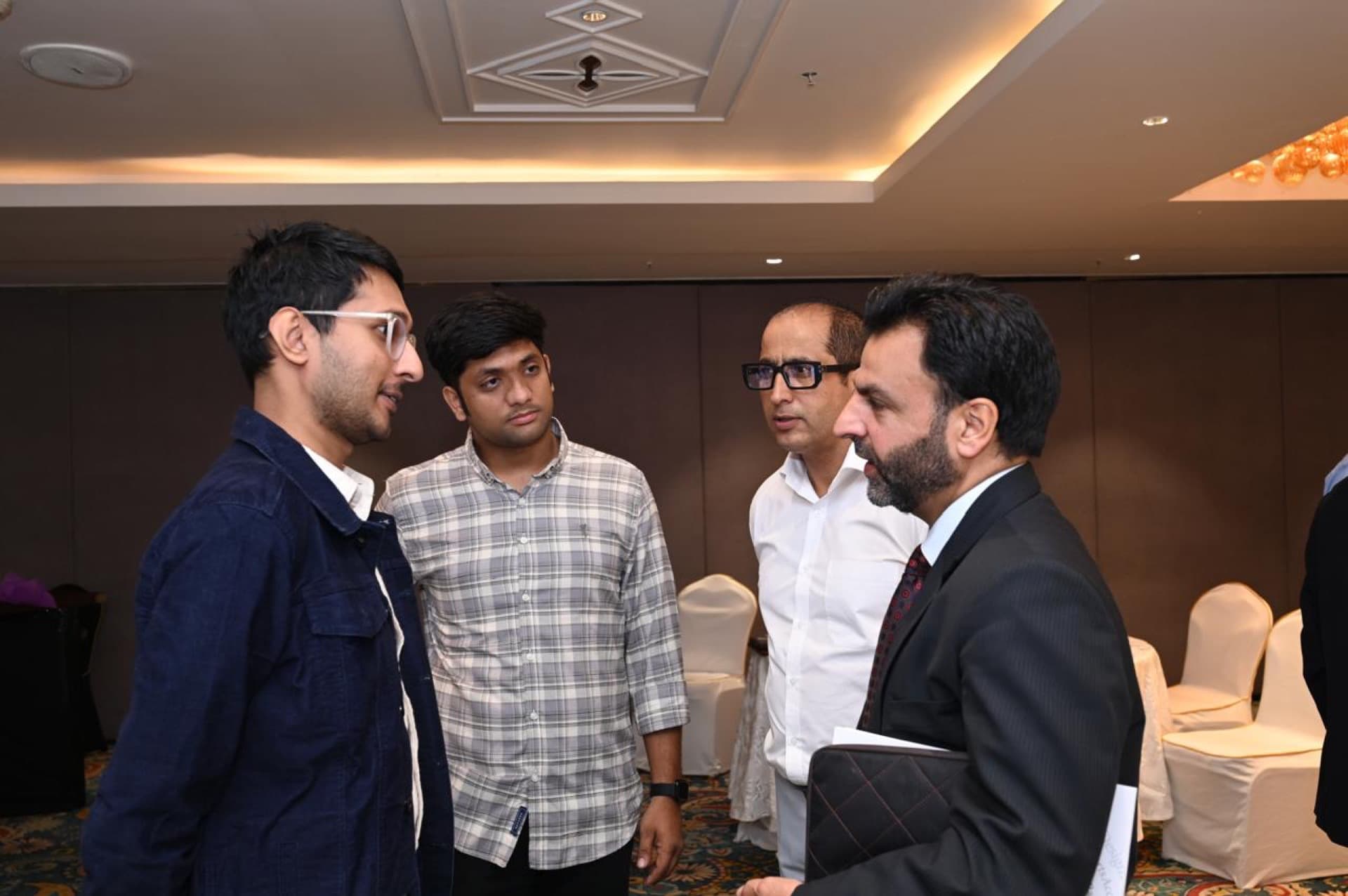 Dr. Aijaz Rather discussing healthcare strategy with team members and volunteers