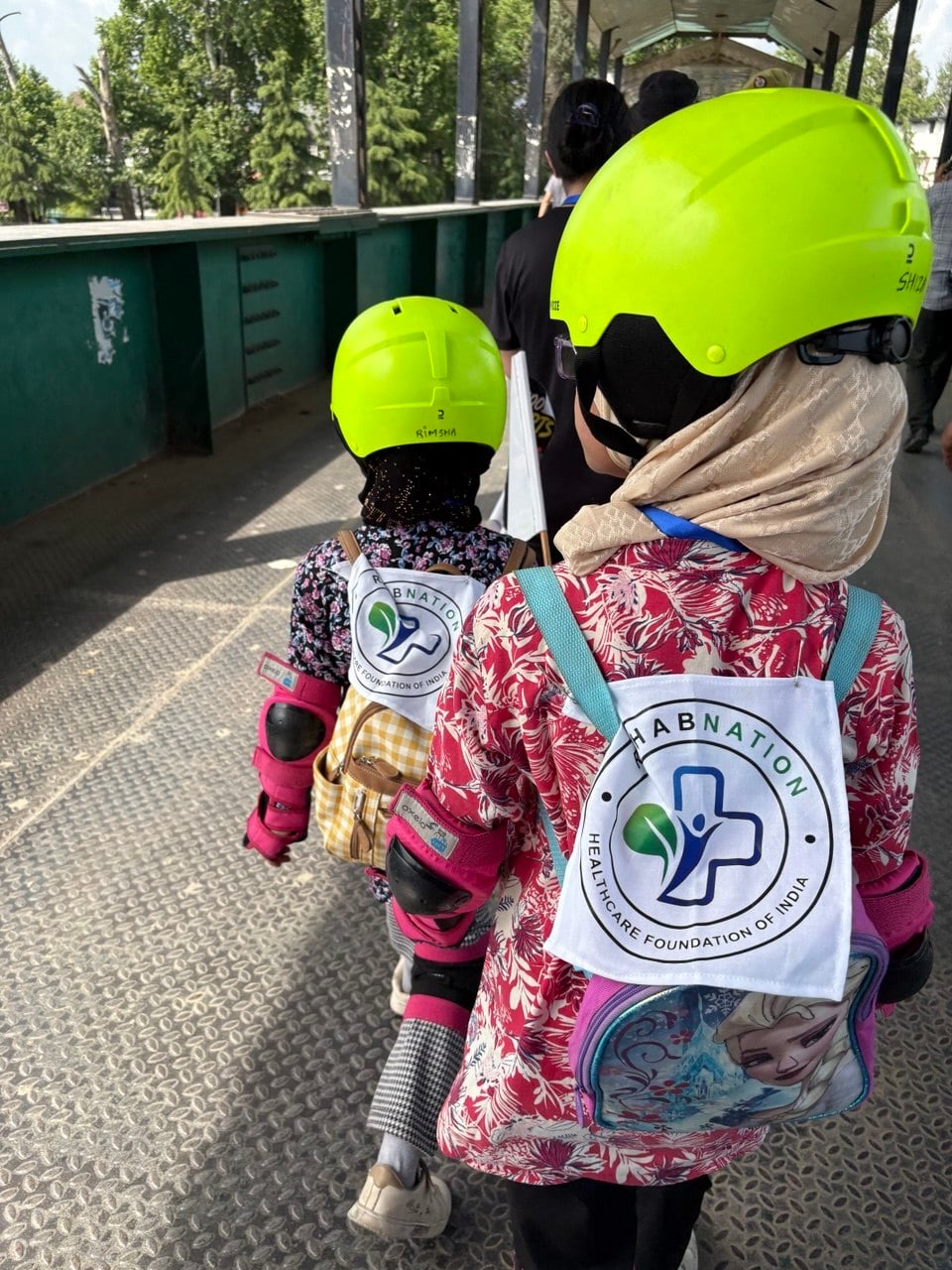 Children wearing RehabNation bags at a community skating event