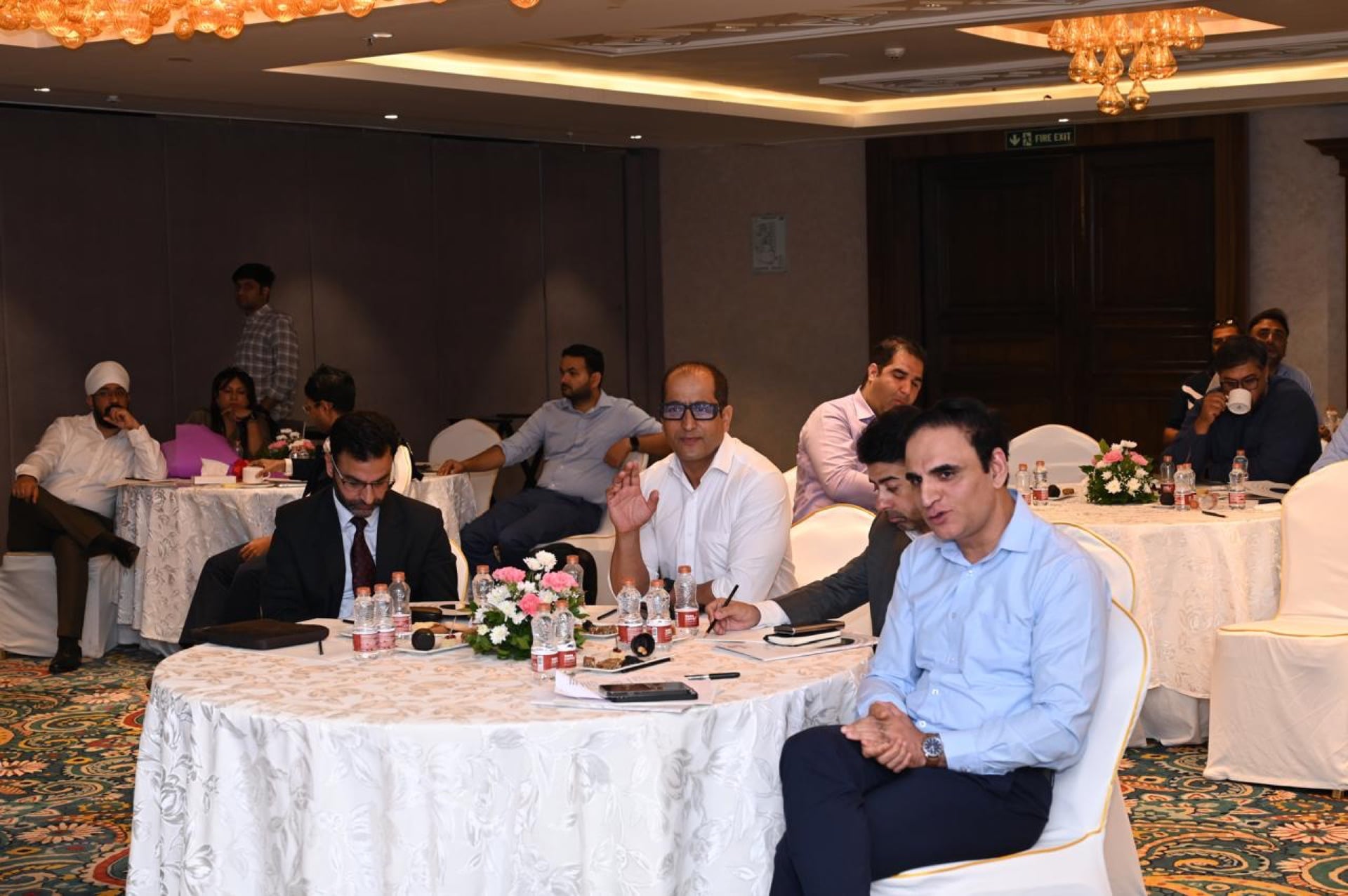 Delegates seated together during a roundtable discussion